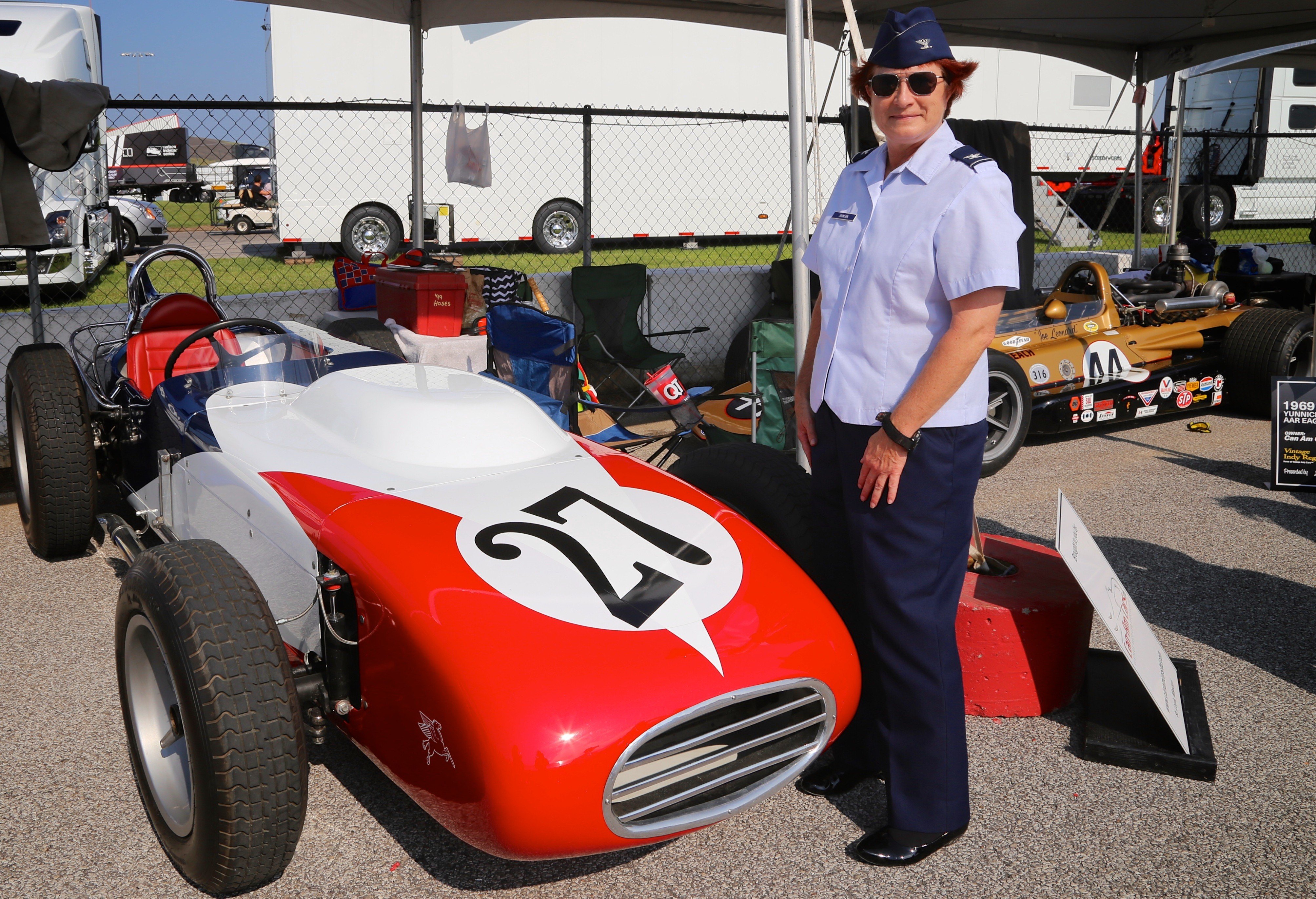 As part of a community outreach event, 932nd Airlift Wing Maintenance Group commander, Col. Sharon Johnson, got a backstage view amazing racing cars.  She was recognized on the big stage in front of the entire stadium with the Indy drivers at the Bommarito Automotive Group 500 Aug. 25, 2018, Gateway Motorsports Park, Madison, Illinois. Here she was shown the "pit row" vintage racers before attending a driver's meeting.  Johnson was an honored VIP to help kick off the 2nd annual IndyCar race which was won by Will Power,  won the 248-lap race around the four-turn, 1.25-mile Gateway Motorsports Park oval paved track in Madison, Illinois, in his #12 Chevrolet by 1.3117 seconds over second place finisher Alexander Rossi.  The 932nd Airlift Wing was represented by maintenance, medical, public affairs staff and operations personnel.  (U.S. Air Force photo by Lt. Col. Stan Paregien